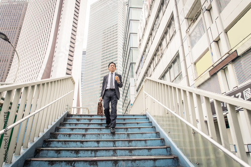 Sticker Japanese businessman in Tokyo with formal business suit