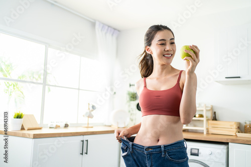 Asian beautiful woman feel happy after lose weight for health in house. 