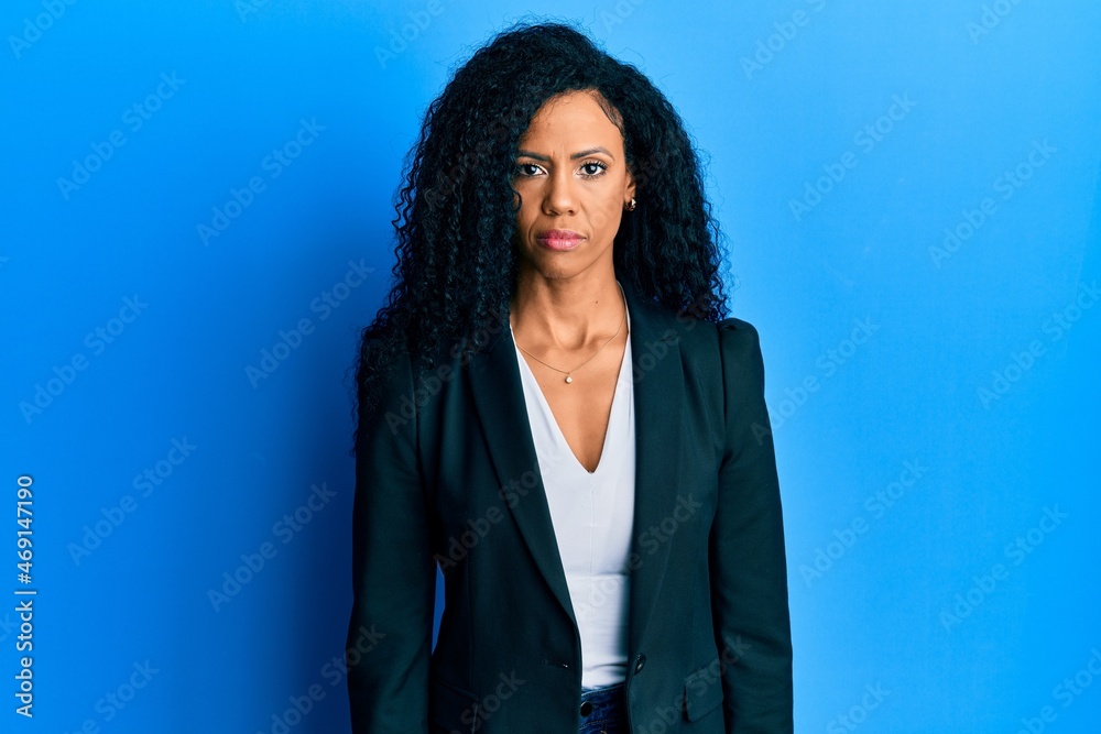 Middle age african american woman wearing business clothes relaxed with ...