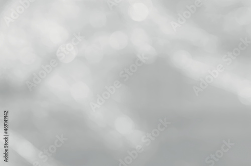 blurred white bokeh on a gray background