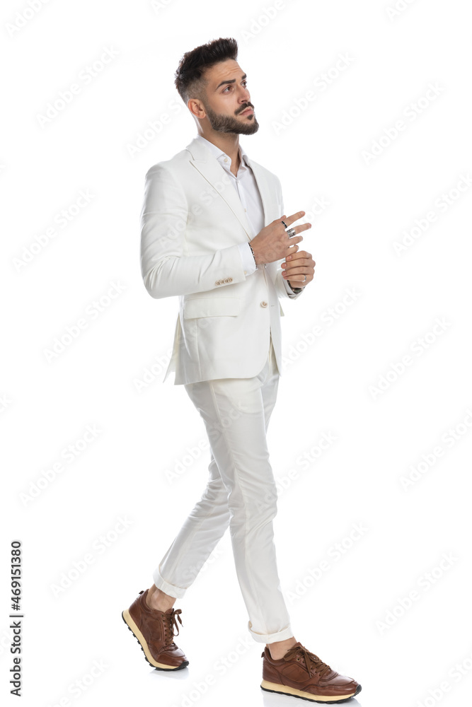 handsome businessman walking and holding his hand handsome businessman walking and holding his hand