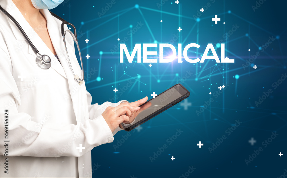 Doctor fills out medical record Doctor fills out medical record