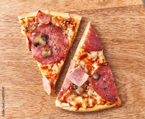  Slices of italian pizza on wooden surface