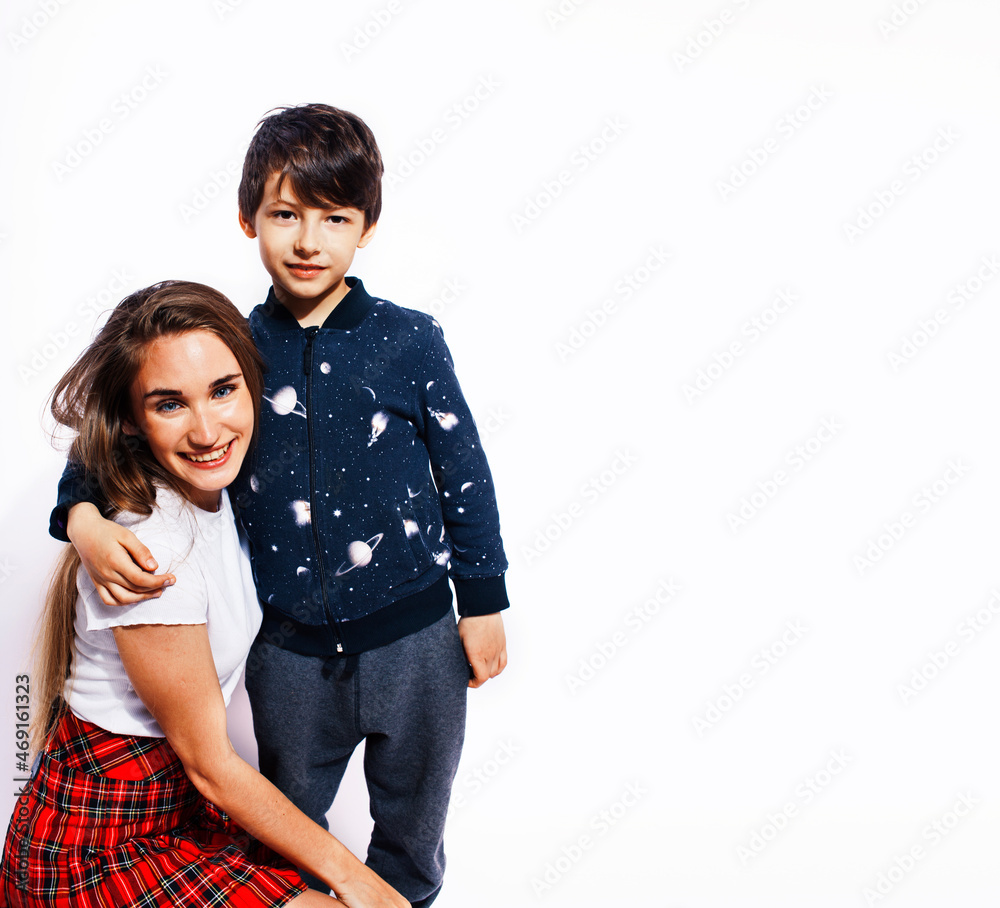 lifestyle and people concept, little cute boy with teenage girl posing together cheerful happy smiling isolated on white background lifestyle and people concept, little cute boy with teenage girl posing together cheerful happy smiling isolated on white background
