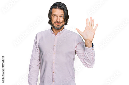 Middle age handsome man wearing business shirt showing and pointing up with fingers number five while smiling confident and happy.