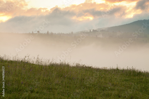 Deep fog in the mountains, view from a mountain pasture. Ukraine, Carpathians.