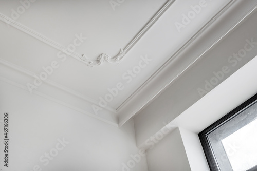 Detail of corner ceiling cornice with intricate crown molding.