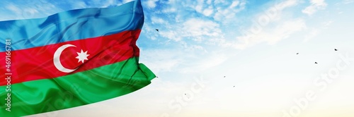 Azerbaijan flag are waving in the spring of the blue sky. 