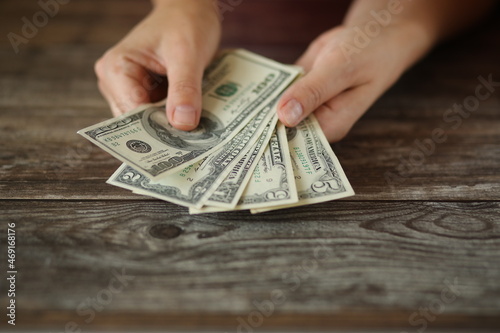 hand with dollar money