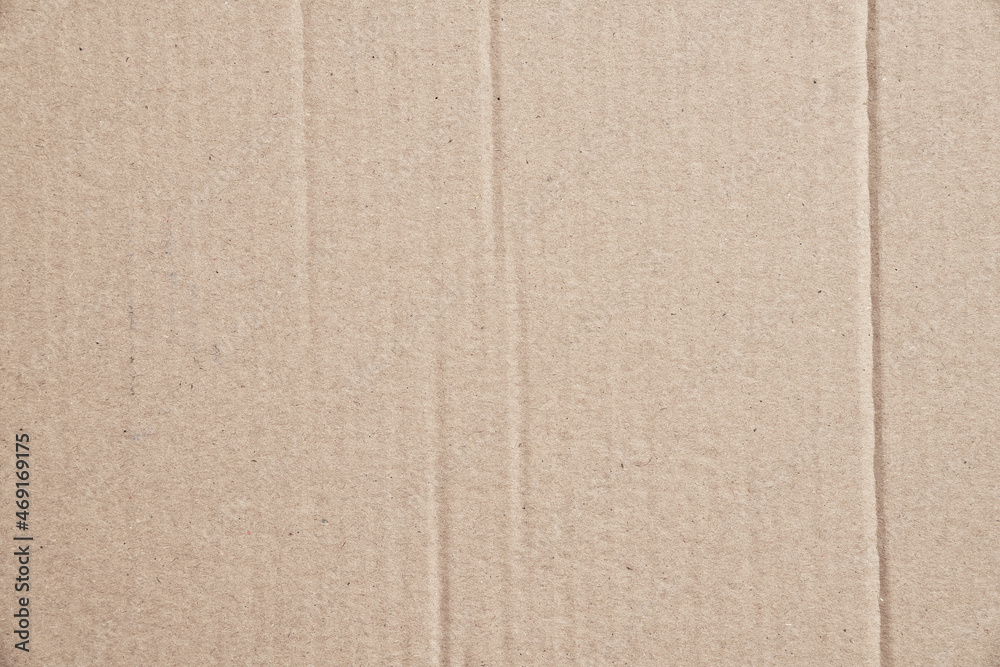 Fototapeta premium Rustic brown paperboard. Rough cardboard kraft texture