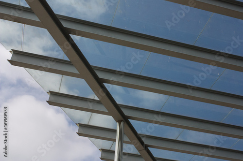 Steel and glass roof crossing the sky