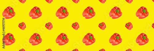 red sweet paprika multiplied in large quantities on colored background, fragrant fresh bell pepper, seamless pattern, design or mockup