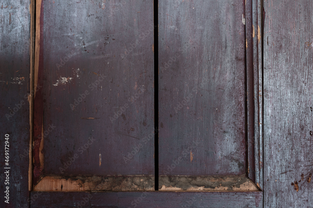 Very old, grunge and aged purple wooden rural closet or locker doors background with copy space. HDR image Very old, grunge and aged purple wooden rural closet or locker doors background with copy space. HDR image