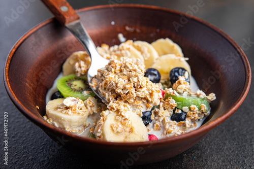 oatmeal bowl fruit breakfast vegetable milk, lactose free, banana, kiwi, berrie, blueberrie meal snack on the table copy space food background