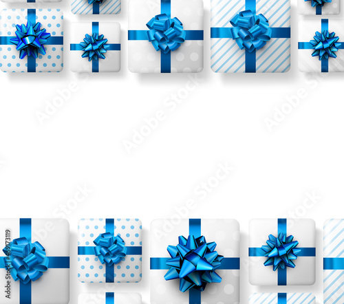 White striped and polka dot gift boxes with blue bow.