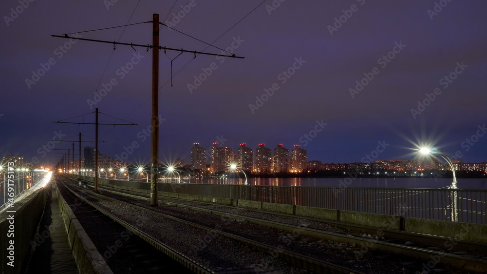 Fototapeta premium Old tram tracks on the North Bridge in Voronezh on an autumn evening