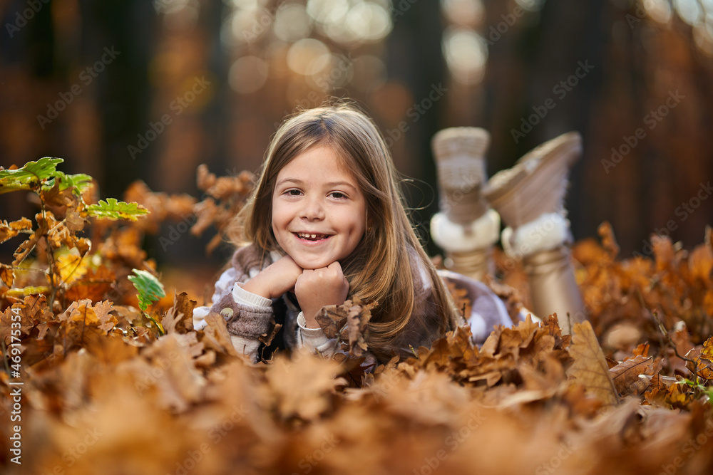 Young caucasian girl, candid autumnal portrait in the forest Young caucasian girl, candid autumnal portrait in the forest
