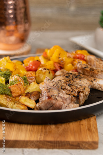 Italian Sheet Pan Pork Chops with Potatoes, Peppers, and Tomatoes 