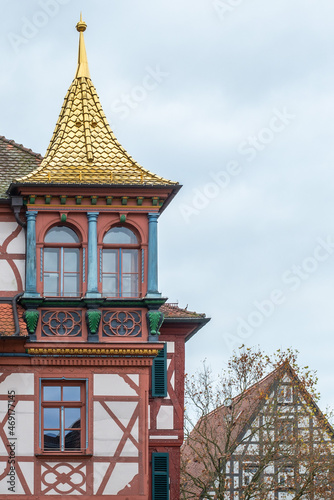 A half-timbered house with a golden roof gable, town hall, Schwabach, Bavaria, Germany