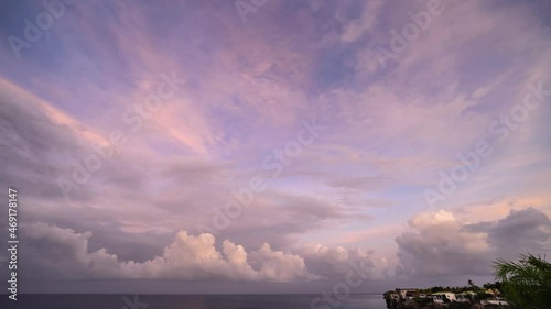 Time lapse sunrise scenery with flying clouds over the ocean around Curacao, the Caribbean photo