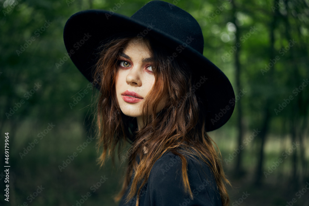 woman dressed as a witch in the forest Halloween fantasy ritual woman dressed as a witch in the forest Halloween fantasy ritual
