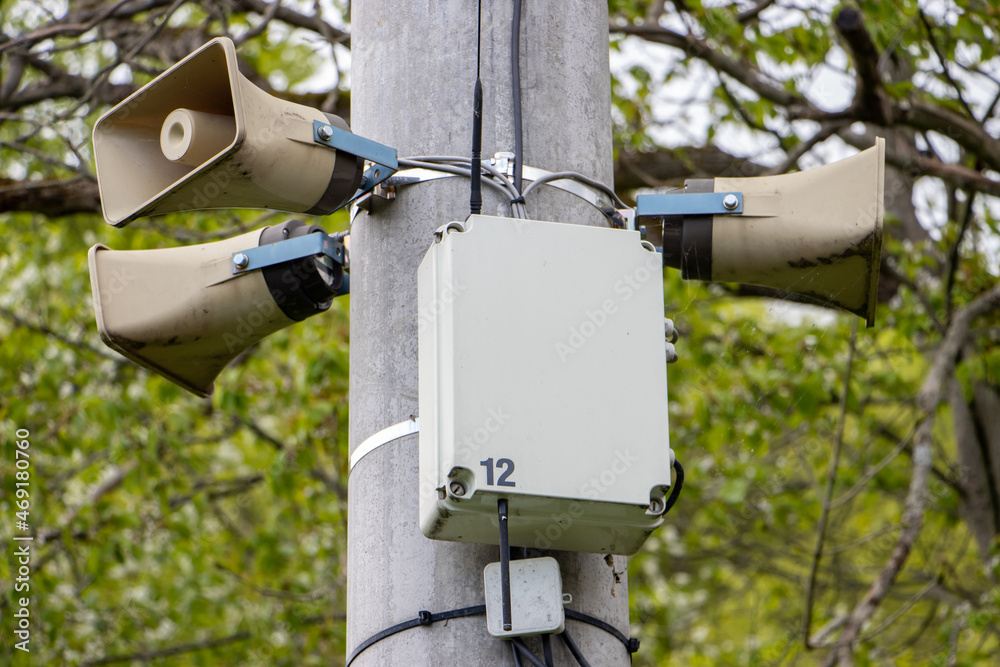 A group of megaphones for public messages is installed on a pole A group of megaphones for public messages is installed on a pole