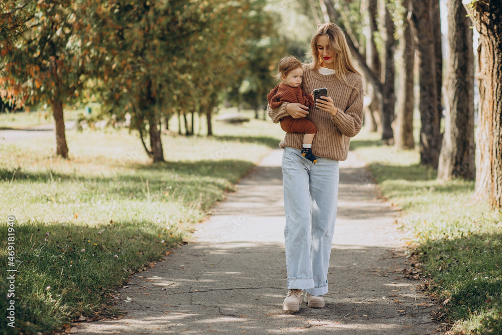 Mother with baby daughter together in park Mother with baby daughter together in park
