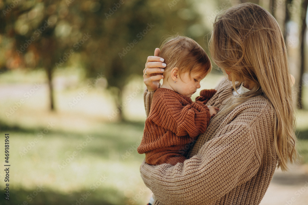Fototapeta premium Mother with baby daughter together in park