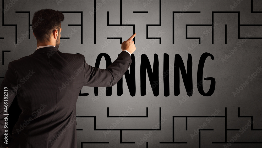 businessman drawing maze concept businessman drawing maze concept