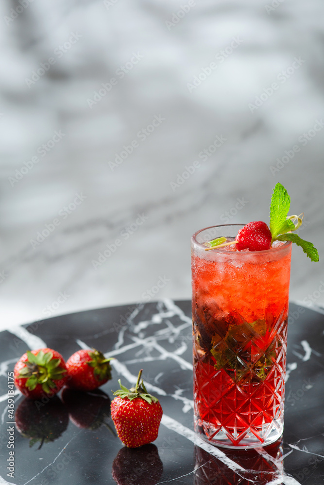 strawberry mojito with mint leaf on marble table. fresh drinks with strawberry on light background strawberry mojito with mint leaf on marble table. fresh drinks with strawberry on light background