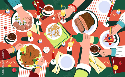 Christmas festive dinner with hands of people, decorated table top view. Delicious traditional holiday dishes on plates. Flat family celebrating thanksgiving day and eating delicious food together.