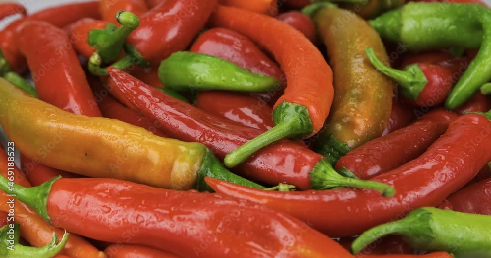 Rotation and approach of a pile of hot peppers in dew drops