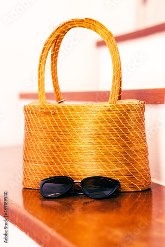 sunglasses and straw bag