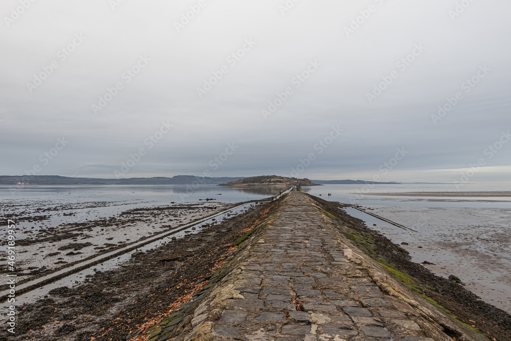 Footpath to Cramond Island at low tide in autumn, Edinburgh, Scotland Footpath to Cramond Island at low tide in autumn, Edinburgh, Scotland