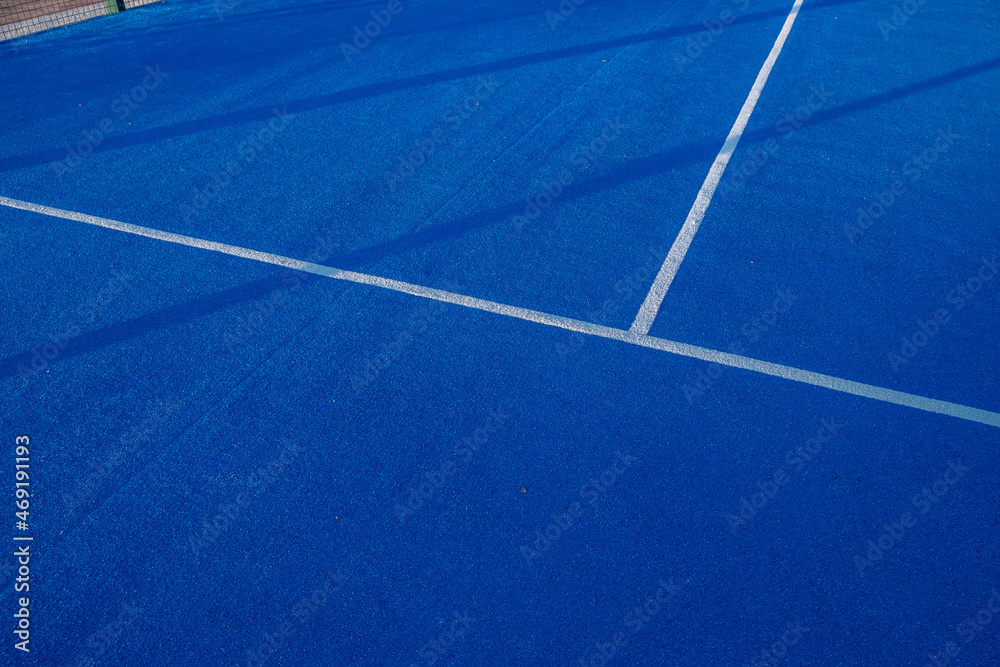 Blue paddle tennis court. Blue court with white lines. Horizontal sport poster, greeting cards, headers, website.