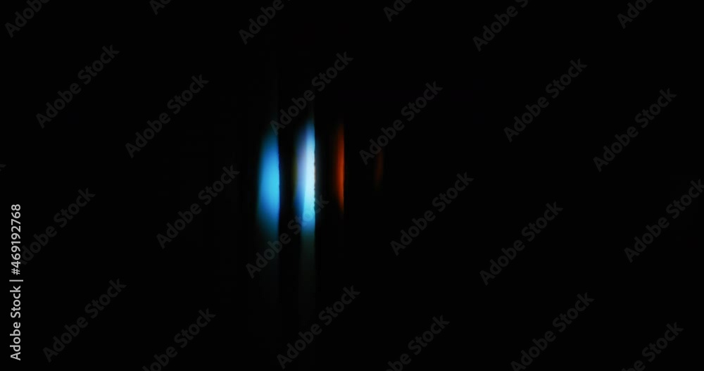 Abstract background of small blue and red circle light moving from side to side. 