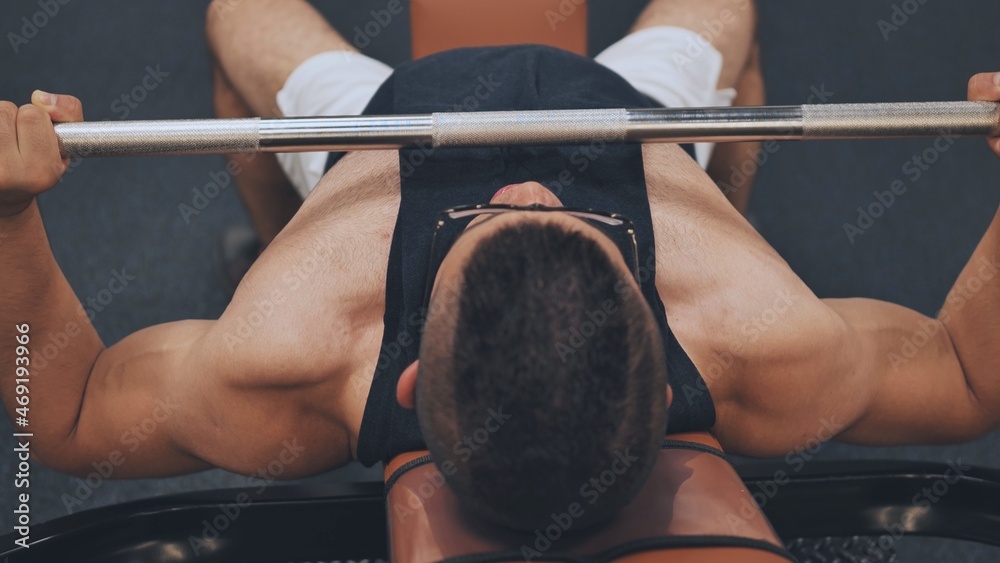 Fototapeta premium An Arab man pumps his chest in the gym.