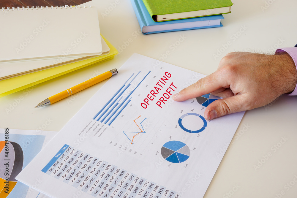 Business concept about OPERATING PROFIT with sign on the piece of paper. Business concept about OPERATING PROFIT with sign on the piece of paper.