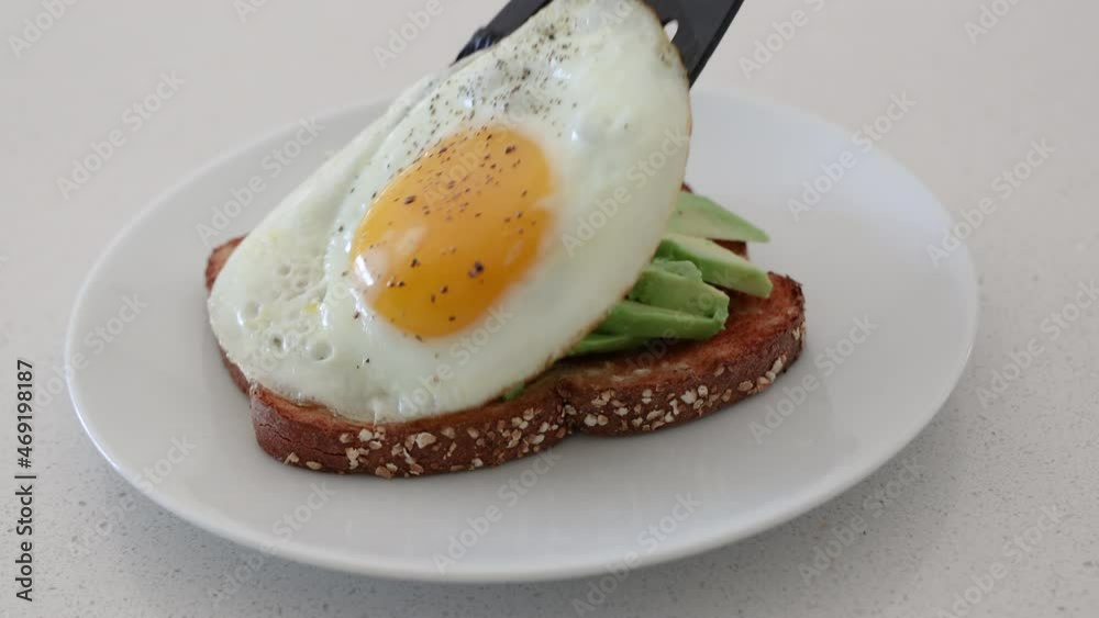 Adding an Egg to Avocado Taost