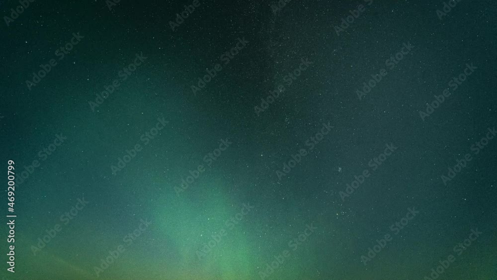 Starry sky with the MIlky way and green splashes of the aurora borealis. Full night timelapse. Starry sky with the MIlky way and green splashes of the aurora borealis. Full night timelapse.