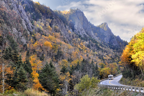 Fotografija Recreational vehicle (RV) driving through scenic steep-walled gorge in remote and rugged Dixville Notch State Park - the northernmost mountain pass in New Hampshire
