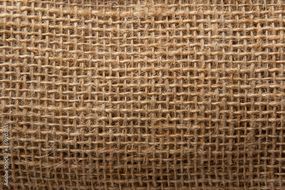 Background with beige jute fiber texture. Background with beige jute fiber texture.