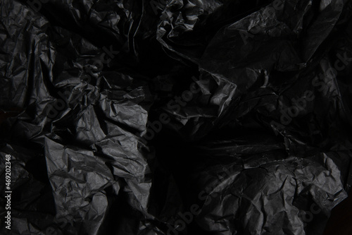 Crumpled black paper texture © Gustavo