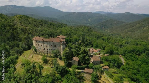 Aerial view around the Casaleggio Boiro castle, Piedmont, Italy - circling, drone shot photo