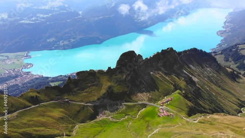 Aerial: mountain ridge in the swiss alps above a lake photo