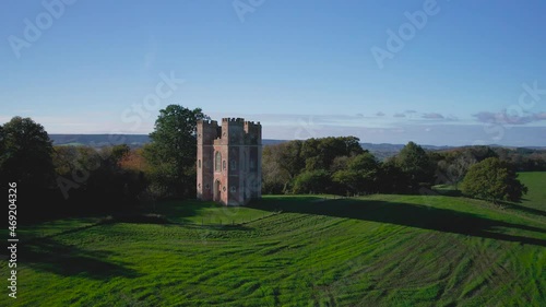 The Belvedere Tower over Powderham Park from a drone in Autumn Colors, Powderham Castle, Exeter, Devon, England photo