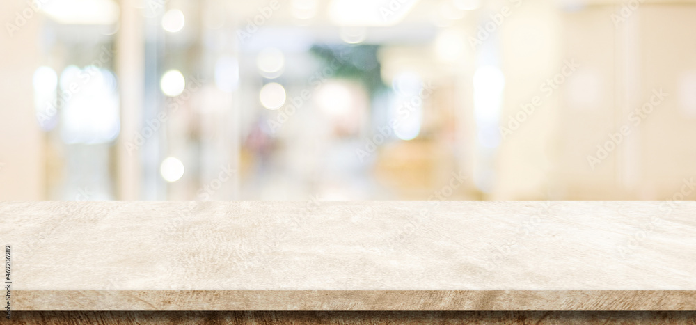 Empty brown cement table over blur store background, product display montage Empty brown cement table over blur store background, product display montage