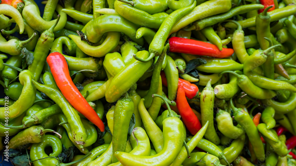 Close-up on a shelf with green and red peppers in the market. Close-up on a shelf with green and red peppers in the market.