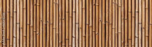 Fototapeta Naklejka Na Ścianę i Meble -  Panorama of  Brown old Bamboo fence texture and background seamless
