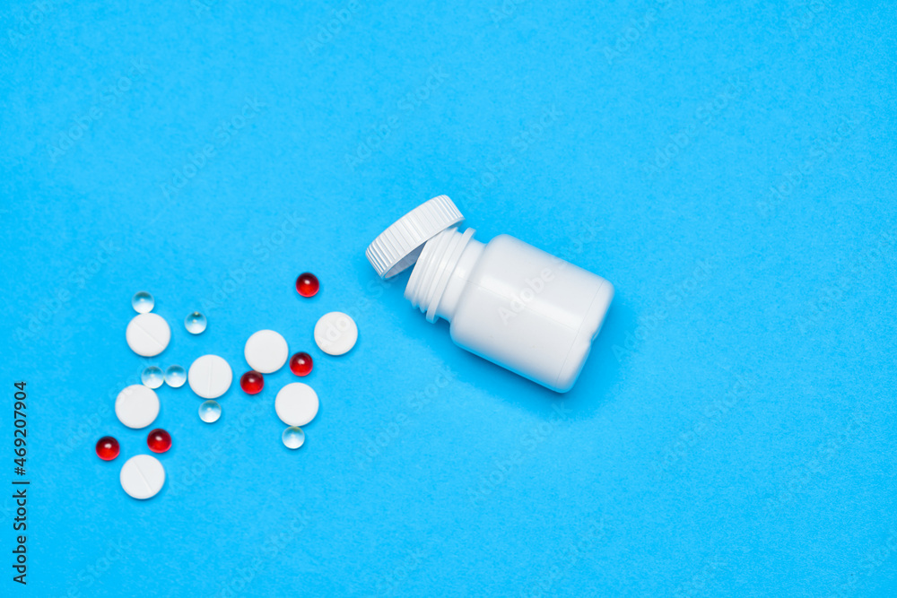 pain reliever vitamins capsules medicine blue background pain reliever vitamins capsules medicine blue background